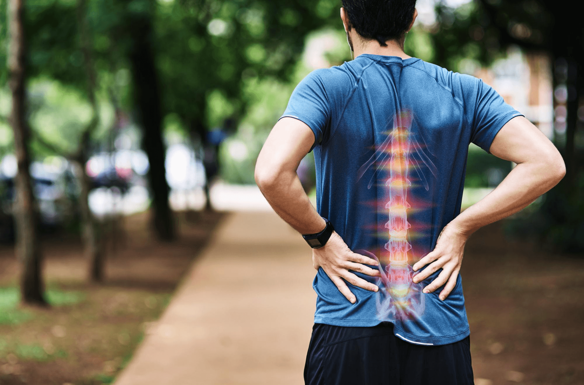Man holding his lower back in pain.